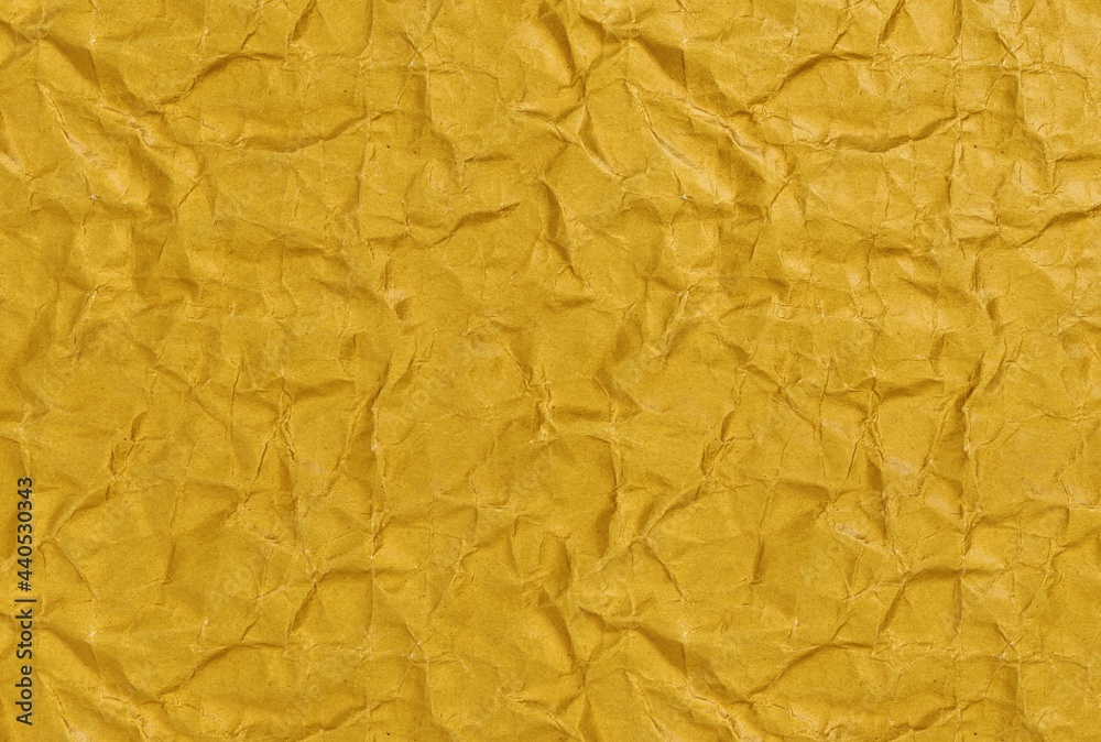 Wrinkled Paper orange background, close-up facade