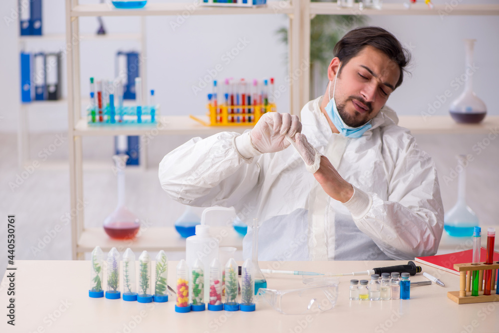 Young male chemist working at the lab during pandemic Young male chemist working at the lab during pandemic