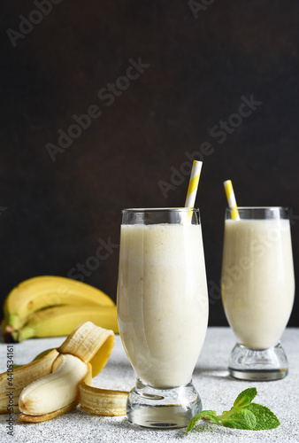 Banana cocktail with ice cream and milk. Fruit milkshake. Breakfast smoothie.