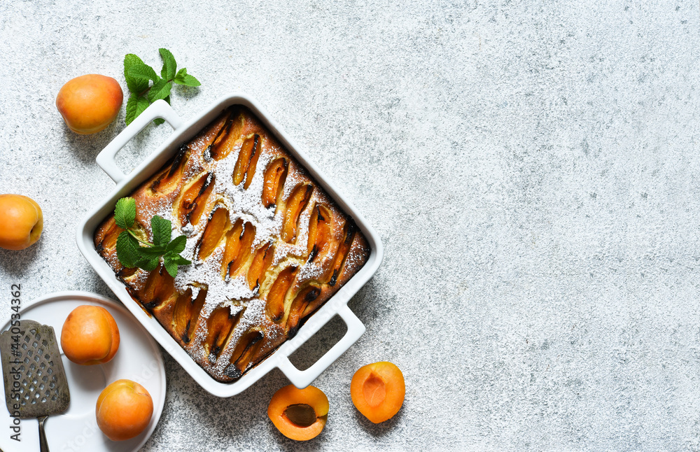 cake with apricots. Homemade pie with peaches and apricots on the kitchen table. cake with apricots. Homemade pie with peaches and apricots on the kitchen table.