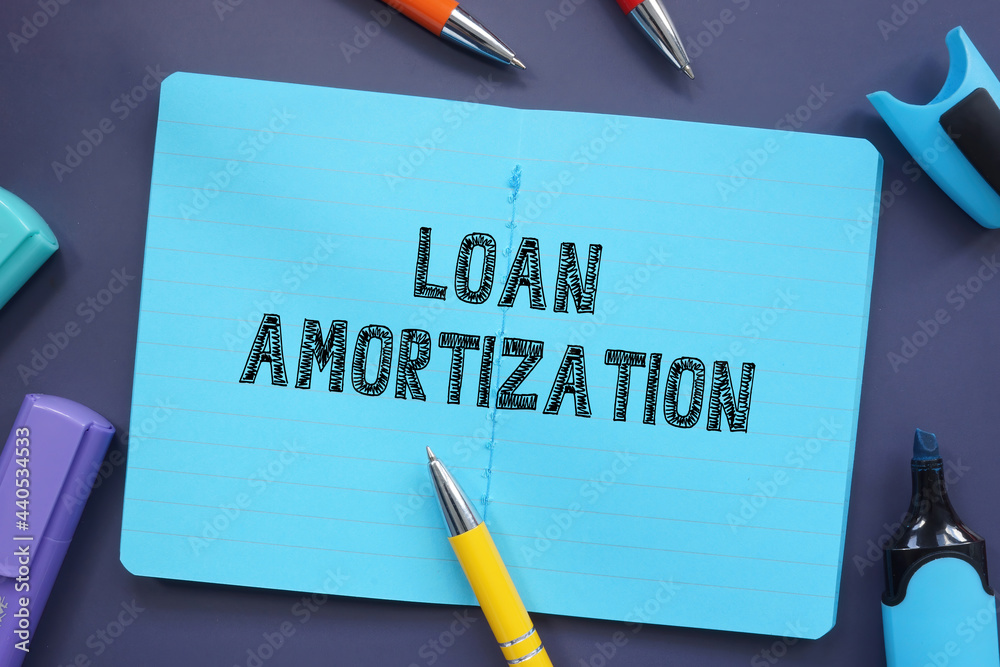 Business concept meaning Loan Amortization with sign on the sheet. Business concept meaning Loan Amortization with sign on the sheet.