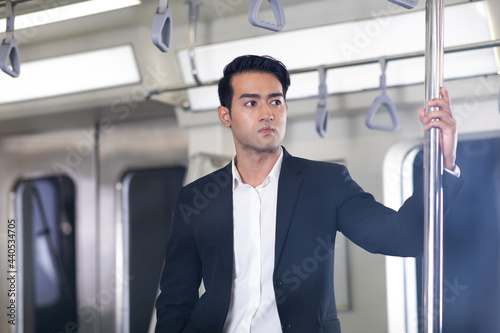 Asian man passengers on Urban Public Transport Metro. Asian people go to work by public transport.