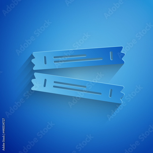 Paper cut Sugar stick packets icon isolated on blue background. Blank individual package for bulk food products as coffee, salt, spices. Paper art style. Vector