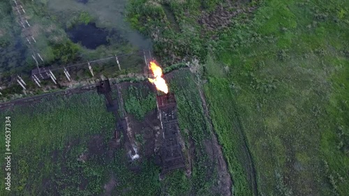 Oil and gas industry. Refining and pumping of oil and gas. Combustion of associated gas. Torch at the oil station. The video was made from a drone.