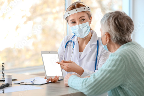 Doctor with tablet computer...