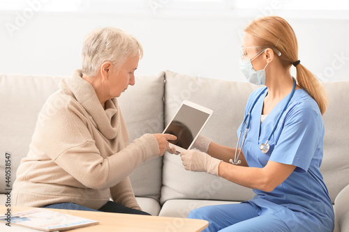 Doctor with tablet computer...
