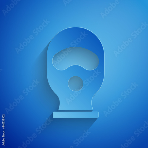 Paper cut Balaclava icon isolated on blue background. A piece of clothing for winter sports or a mask for a criminal or a thief. Paper art style. Vector