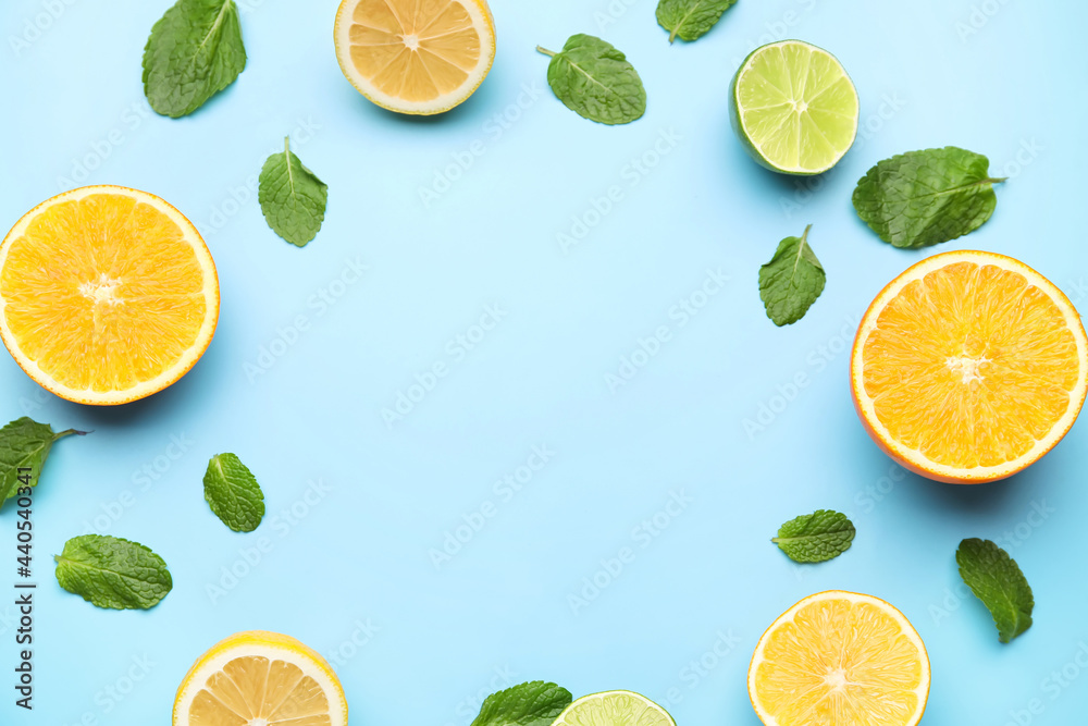 Frame made of healthy citrus fruits on color background