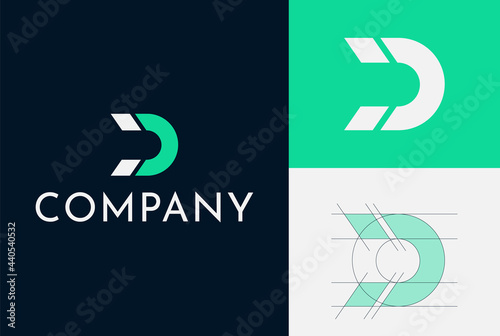 Logo Design For A Magnet Company. Letter D And Magnet Shape Are Combined. Clean And Simple. Grid system. Green and blue colors are used.