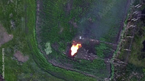 Oil and gas industry. Refining and pumping of oil and gas. Combustion of associated gas. Torch at the oil station. The video was made from a drone.