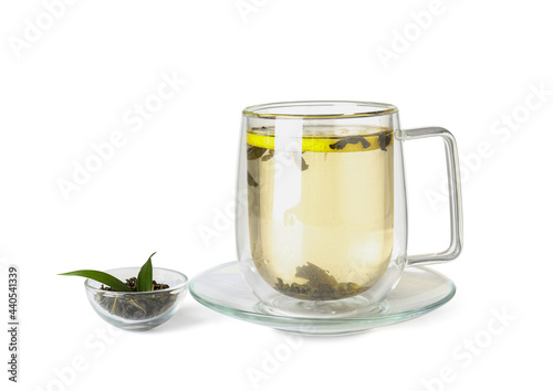 Cup of hot green tea on white background