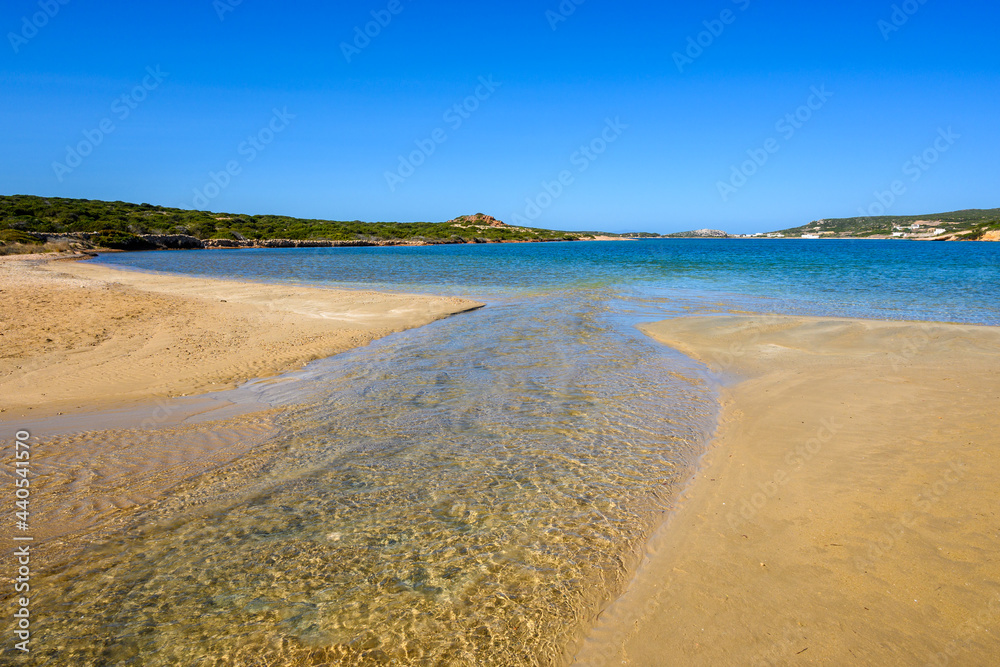 Stefano Beach with a strip of sand that connects Island of Paros with the islet of Oikonomou. This secluded beach is located between Naoussa and Santa Maria. Cyclades, Greece