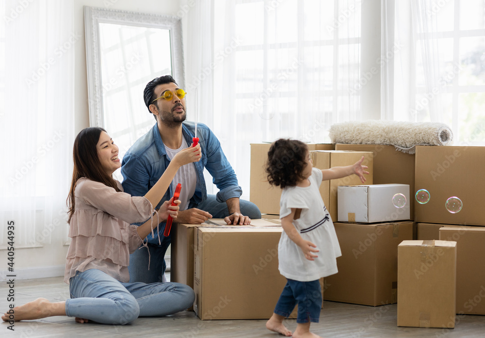 Happy time family blow soap bubbles relax in living room. Everyone having fun in the house. Happy time family blow soap bubbles relax in living room. Everyone having fun in the house.