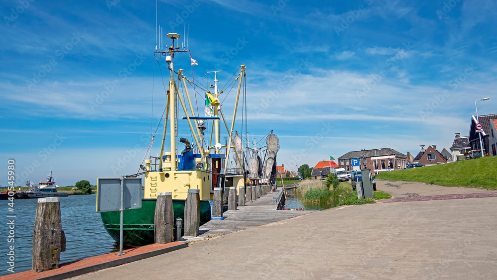 Traditional fishing boats in the harbor from Workum in the Netherlands