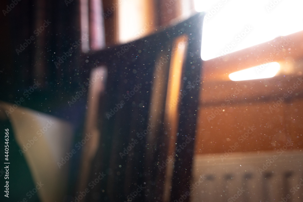 Dust particles in an old vintage wooden room. Visible particles of
