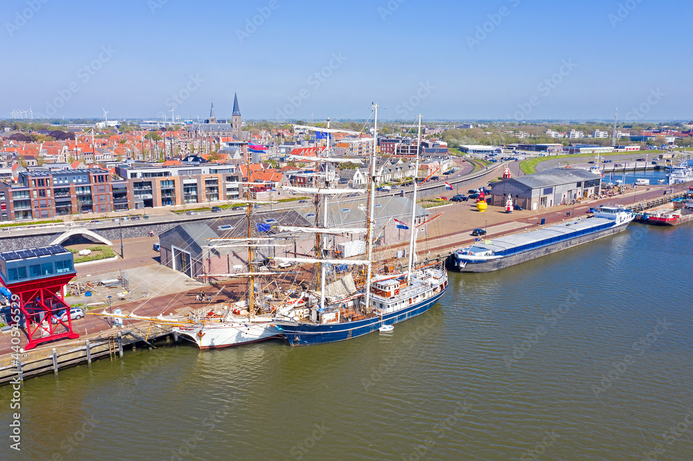 Aerial from the city Harlingen with traditional sailing ships in the Netherlands