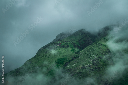 Green Mountain peaks covered with clouds on an overcast day