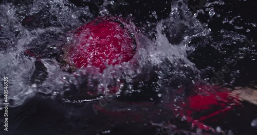 Wallpaper Mural triathlon athlete swimming in dark night wearing wetsuit Torontodigital.ca