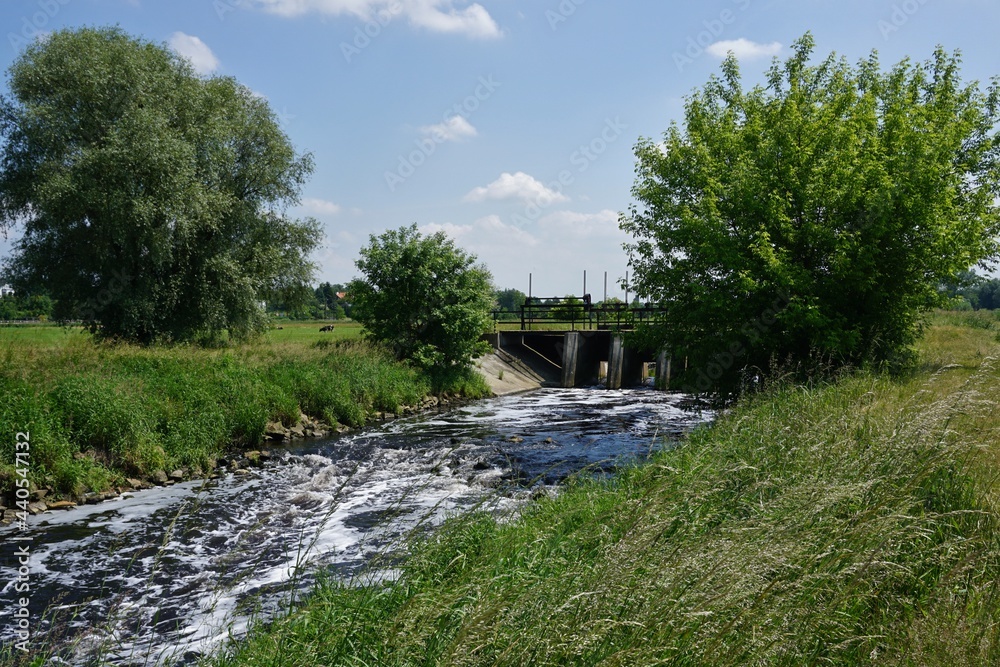 A small dam - water tame over the river A small dam - water tame over the river