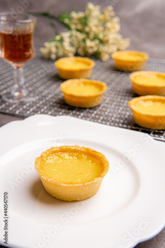 The egg tart  is a kind of custard tart found in Cantonese cuisine derived from the English custard tart and Portuguese pastel de nata. Egg tarts are often served at dim sum restaurants and cha chaan 