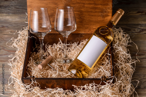 Box with bottle of wine and...