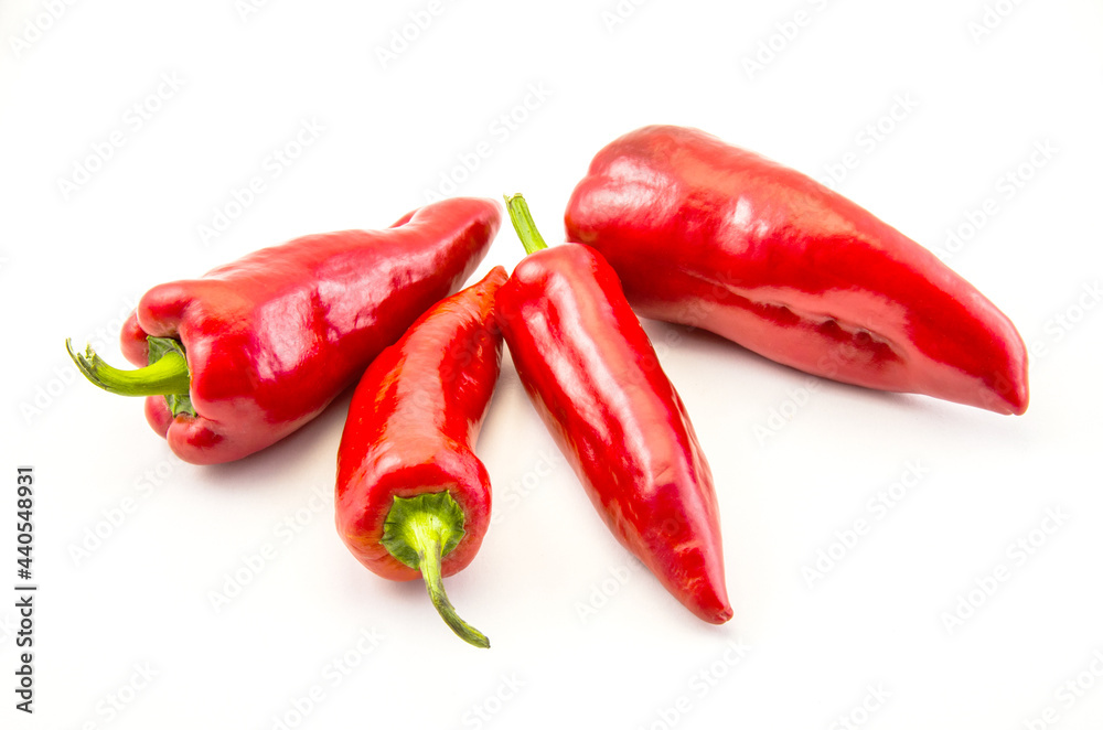 Red hot chili peppers on a white background.
