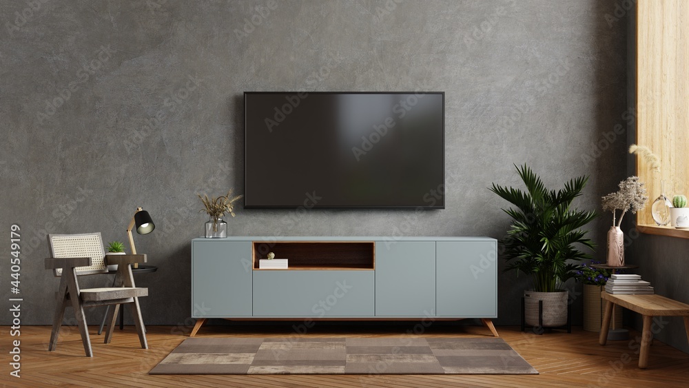 Living room interior have tv on cabinet in cement room with concrete wall. Living room interior have tv on cabinet in cement room with concrete wall.