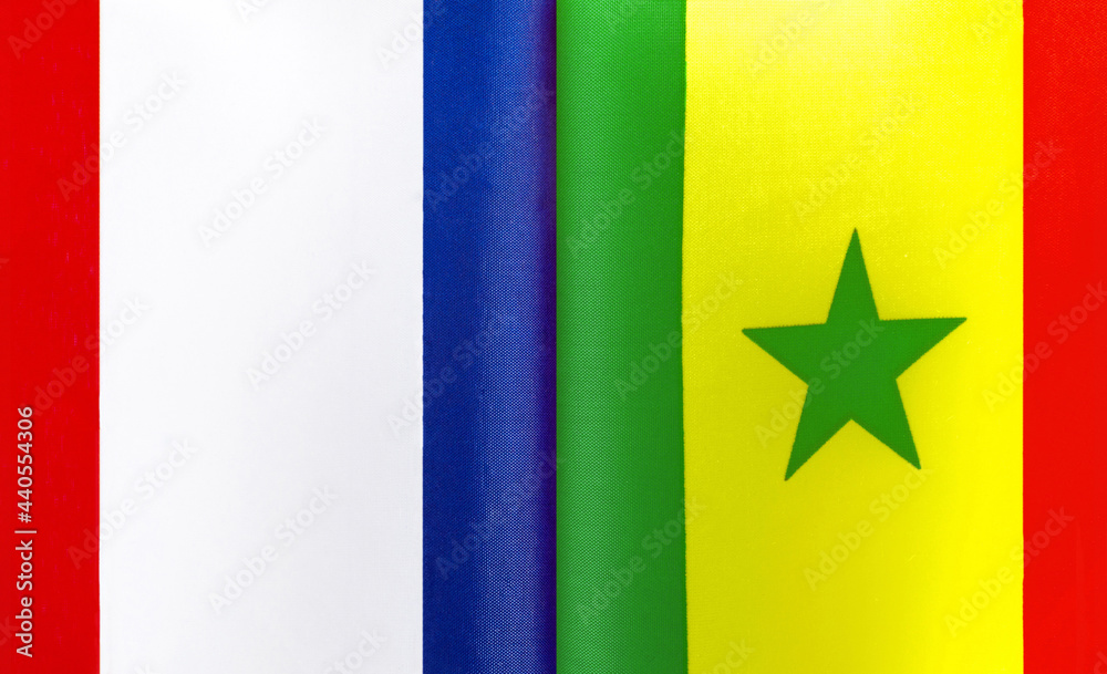 Naklejka premium fragments of the national flags of France and the Republic of Senegal close-up