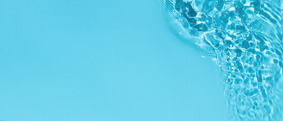 Transparent blue clear water surface texture with ripples, splashes and bubbles. Abstract summer banner background Water waves in sunlight with copy space Cosmetic moisturizer micellar toner emulsion