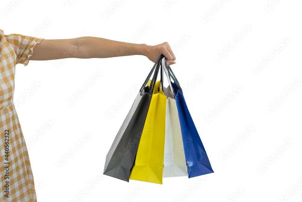Close-up of woman hands holding shopping bags isolated on white background
