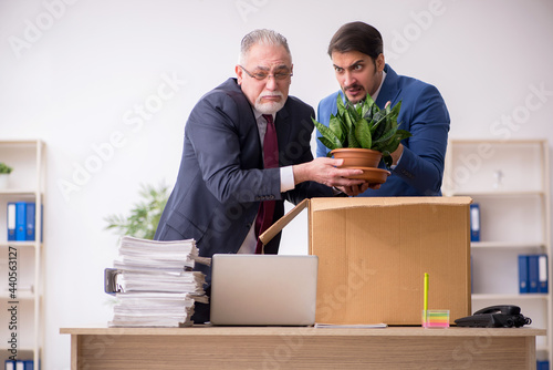 Two male employees in dismissal concept