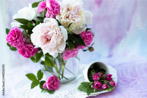 Still life with white and pink peonies in a vase © liliya kulianionak