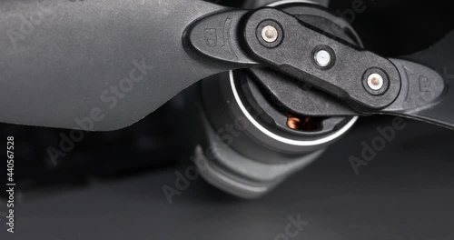 Quadcopter propellers and motor close up after blurred background. High quality 4k footage