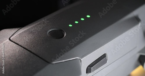 The male finger turns the drone on and then off by pressing a button. Trial activation. High quality 4k footage