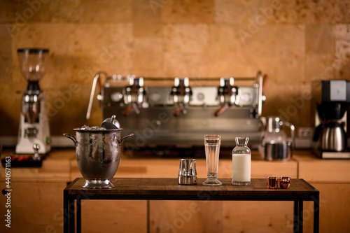 front view of table with kitchen equipment for making coffee and cocktails