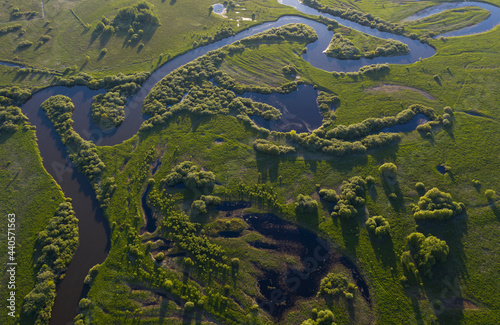 Aerial view of winding river bed with ducts.