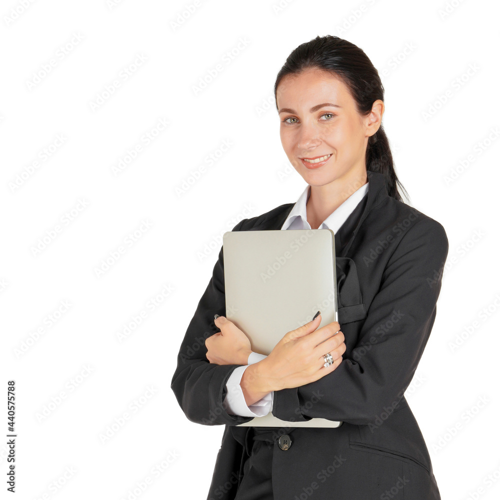 Caucasian business woman in black suit holding a notebook computer with both hands. Portrait on white background with studio light. Caucasian business woman in black suit holding a notebook computer with both hands. Portrait on white background with studio light.