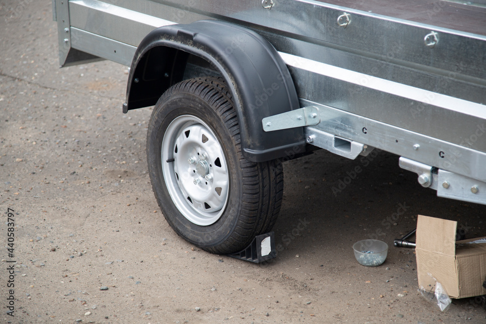 A store that sells trailers.Car open trailer. Transport for cargo transportation. A store that sells trailers.Car open trailer. Transport for cargo transportation.