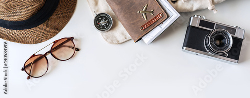 Retro camera with travel accessories and items on white background with copy space, Travel concept, Top view