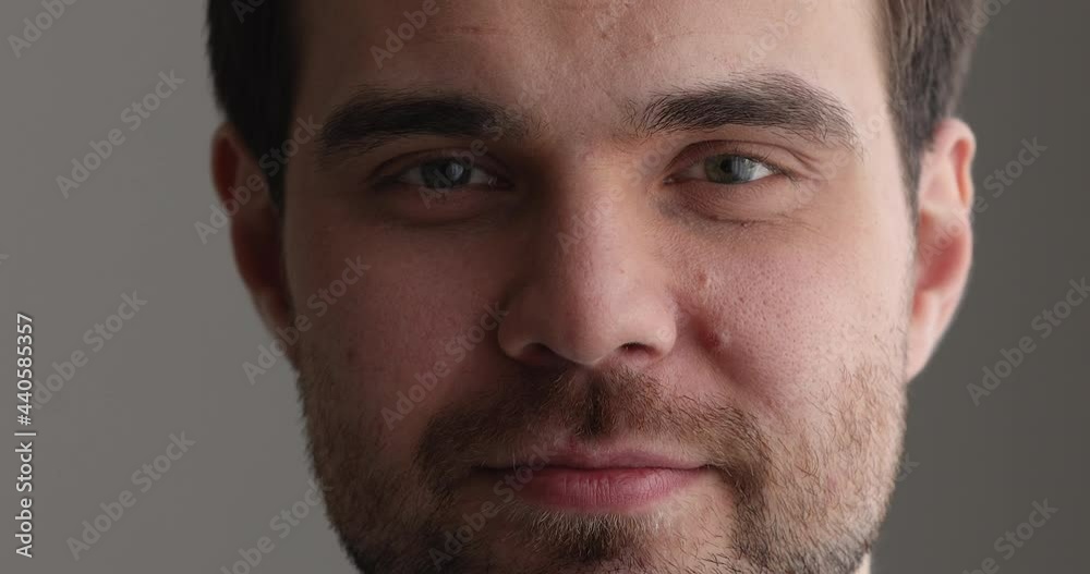 Close up view face of smiling attractive 30s male. Caucasian guy advertise dental clinic services, eye surgery procedure, skincare treatment and cosmetics for man products, positive emotions concept Close up view face of smiling attractive 30s male. Caucasian guy advertise dental clinic services, eye surgery procedure, skincare treatment and cosmetics for man products, positive emotions concept