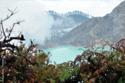 Kawah Ijen volcano and sulfur lake is composite volcanoes in the Banyuwangi Regency of East Java, Indonesia, Kawah ijen have Blue fire crater and Sulfur mining. Blue Nature Travel Background photo