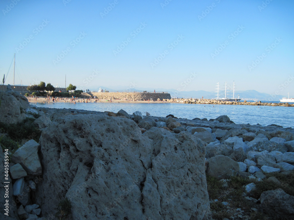 Dusk view of the sea country in the evening sunlight. Beautiful rocky panoramic landscape at sunset. Scenic horizon and summer blue sky.