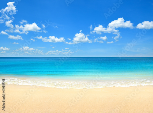Summer beach with blue sky and clouds background.