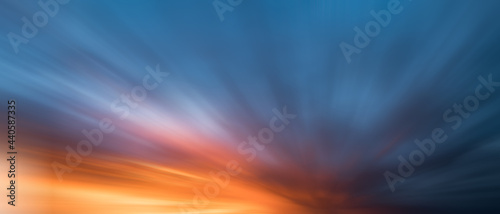 Valokuva Orange sky during sunset with long exposure, blur effect