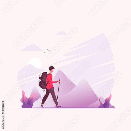 A Man hiking in the mountains with a backpack.
