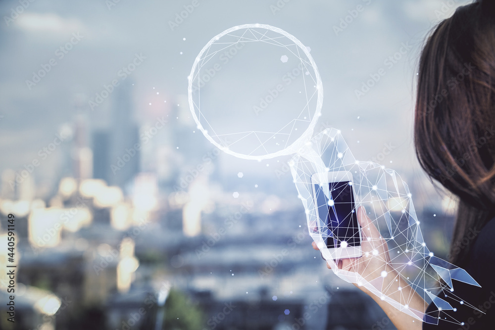Obraz premium Double exposure of creative hologram and woman holding and using a mobile device. Start up concept.