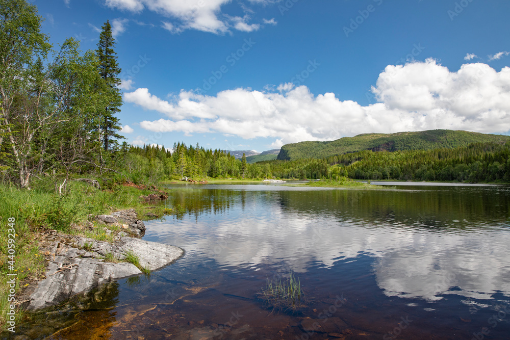 On a trip along Lake Strauman in Velfjord ,with blue sky and white ,Helgeland,Nordland county,scandinavia,Europe On a trip along Lake Strauman in Velfjord ,with blue sky and white ,Helgeland,Nordland county,scandinavia,Europe