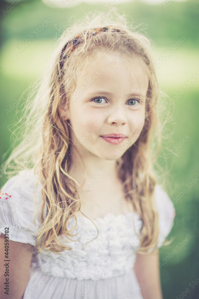 Fototapeta premium dreamy portrait of a young girl outdoor