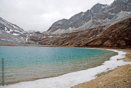 Landscape nature Milk Lake at yading china. Milk Lake is a stunning glacier fed blue lake on the south end of Mt. Chenresig , Daocheng Country,China - hikes to epic mountains and adventure backpack