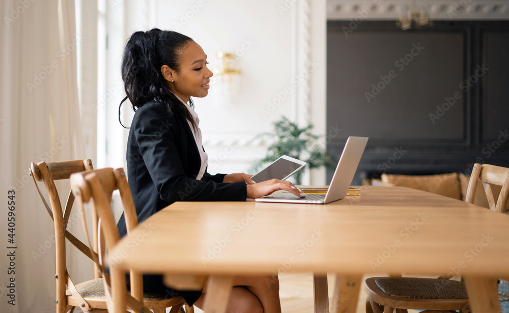 Happy manager consultant woman answers the mail to the client. Online video training in coworking. Administrator Afro appearance favorite job in the office. Happy manager consultant woman answers the mail to the client. Online video training in coworking. Administrator Afro appearance favorite job in the office.